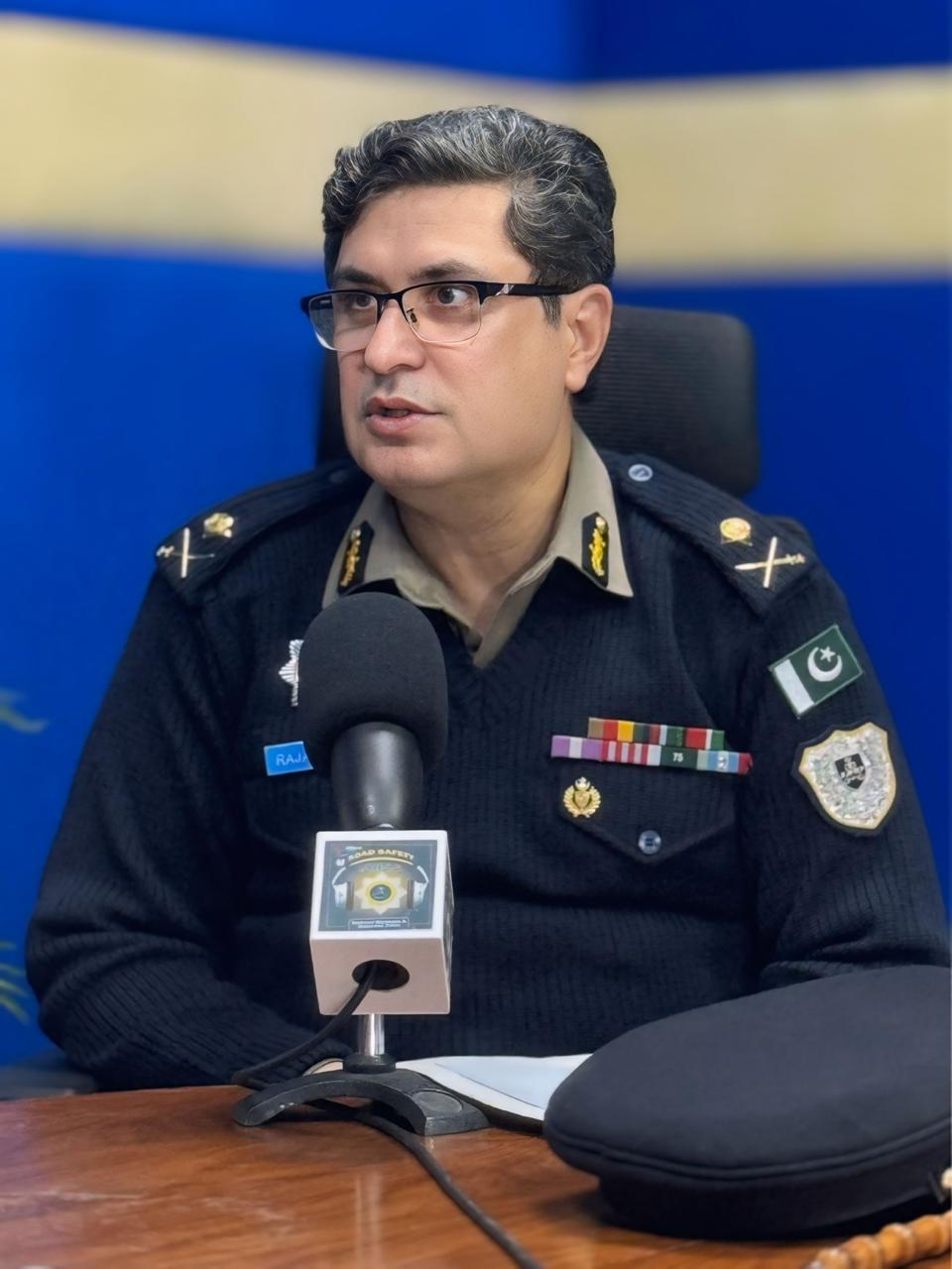 IG, NHMP, RIFFAT MUKHTAR RAJA IS ANSWERING THE QUESTIONS DURING AN E-KHULI KACHEHRI AT FM-95 RADIO
